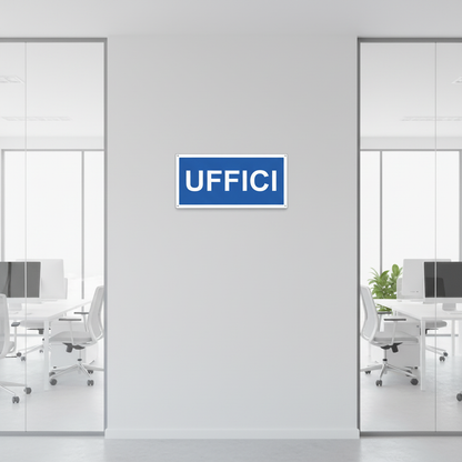 Cartello UFFICI tra vetrate di uffici moderni